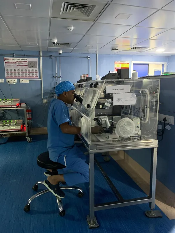 Embryology professional working inside a controlled IVF laboratory
